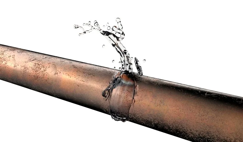 Plumber responding to a burst pipe emergency in Tucson