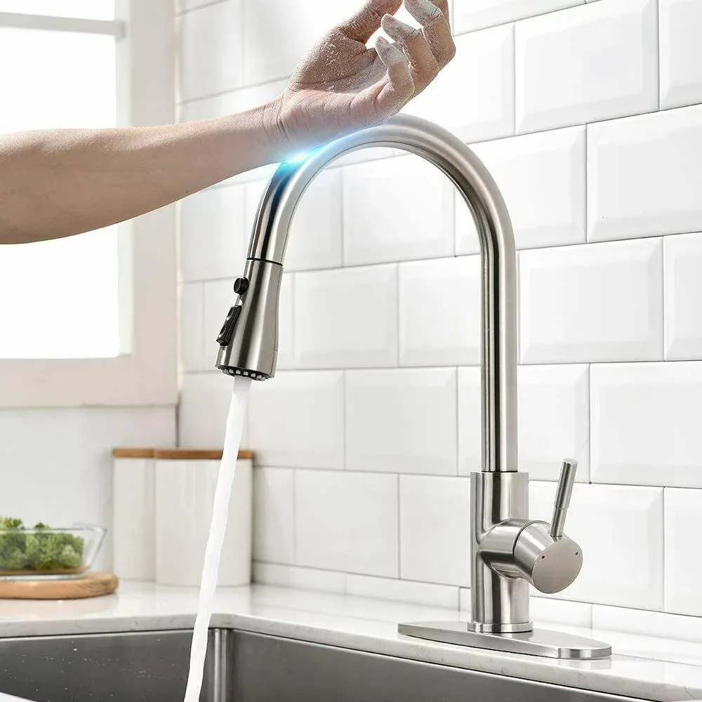 Wrist tapping a brushed nickel touch-activated kitchen faucet to start the water